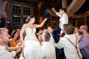 Bride and Groom during the Hora at Josia's River Farm in York Maine