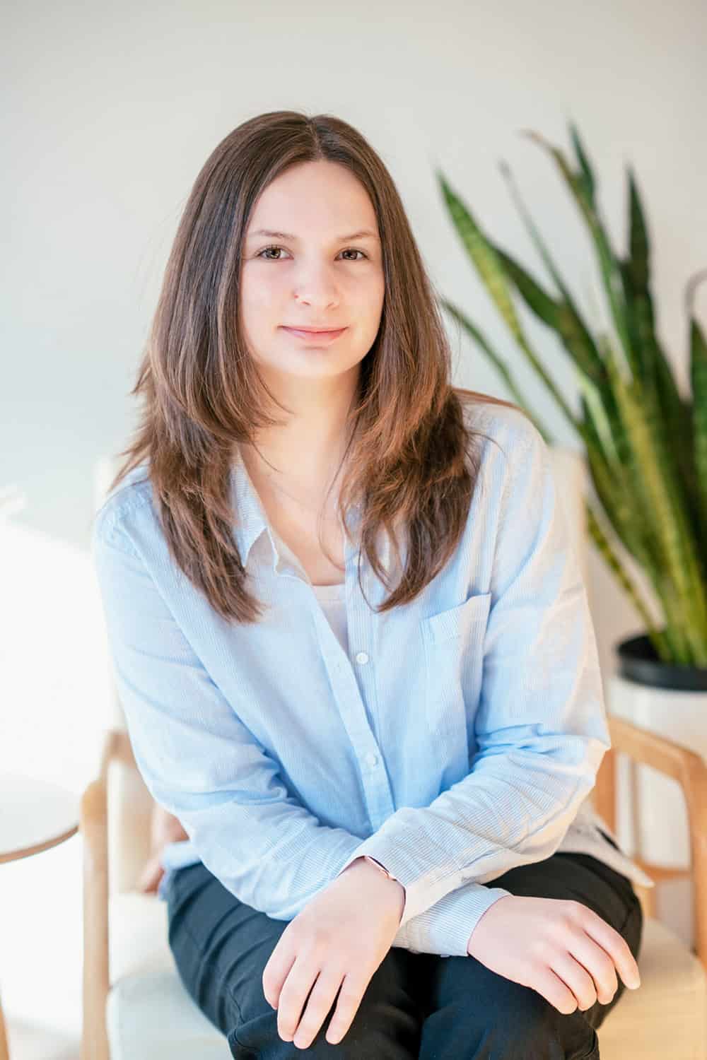 Therapist business portraits in a cozy office space.