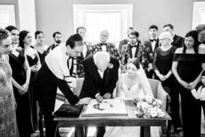 Couple during the Katubah signing at their wedding in Salem, MA