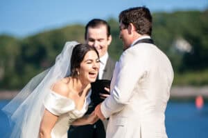 Couple laughs during their vows at their Dockside Restaurant Wedding in York Maine