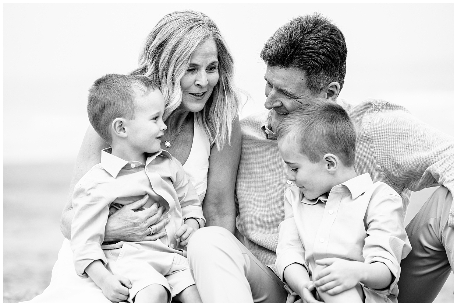 Family dressed in blues and whites for their Wells Beach Family Portraits captured by Wells Beach Family Photographer