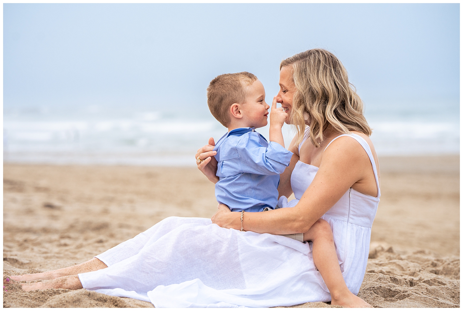 Family dressed in blues and whites for their Wells Beach Family Portraits captured by Wells Beach Family Photographer