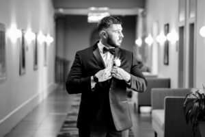 Groom gets ready in a GQ style groom photo at the Danversport Yacht Club Wedding