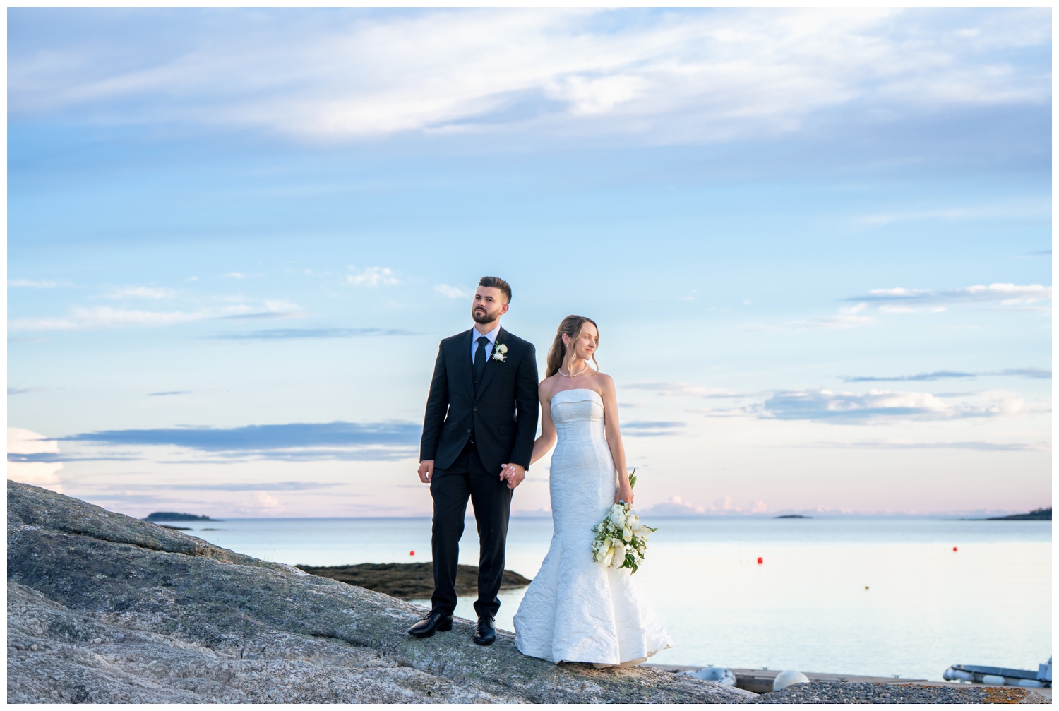 Sebasco Harbor Resort Wedding Photographers Capture the couple on the rocks
