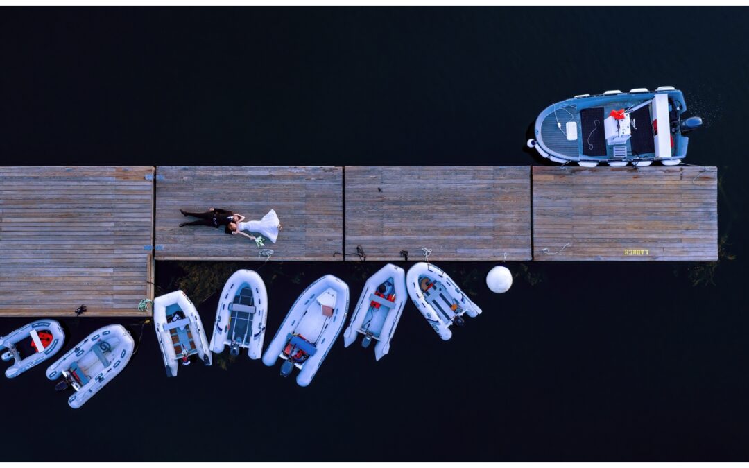 Sebasco Harbor Resort Wedding Photographers Capture a couple with a drone shot on the docks
