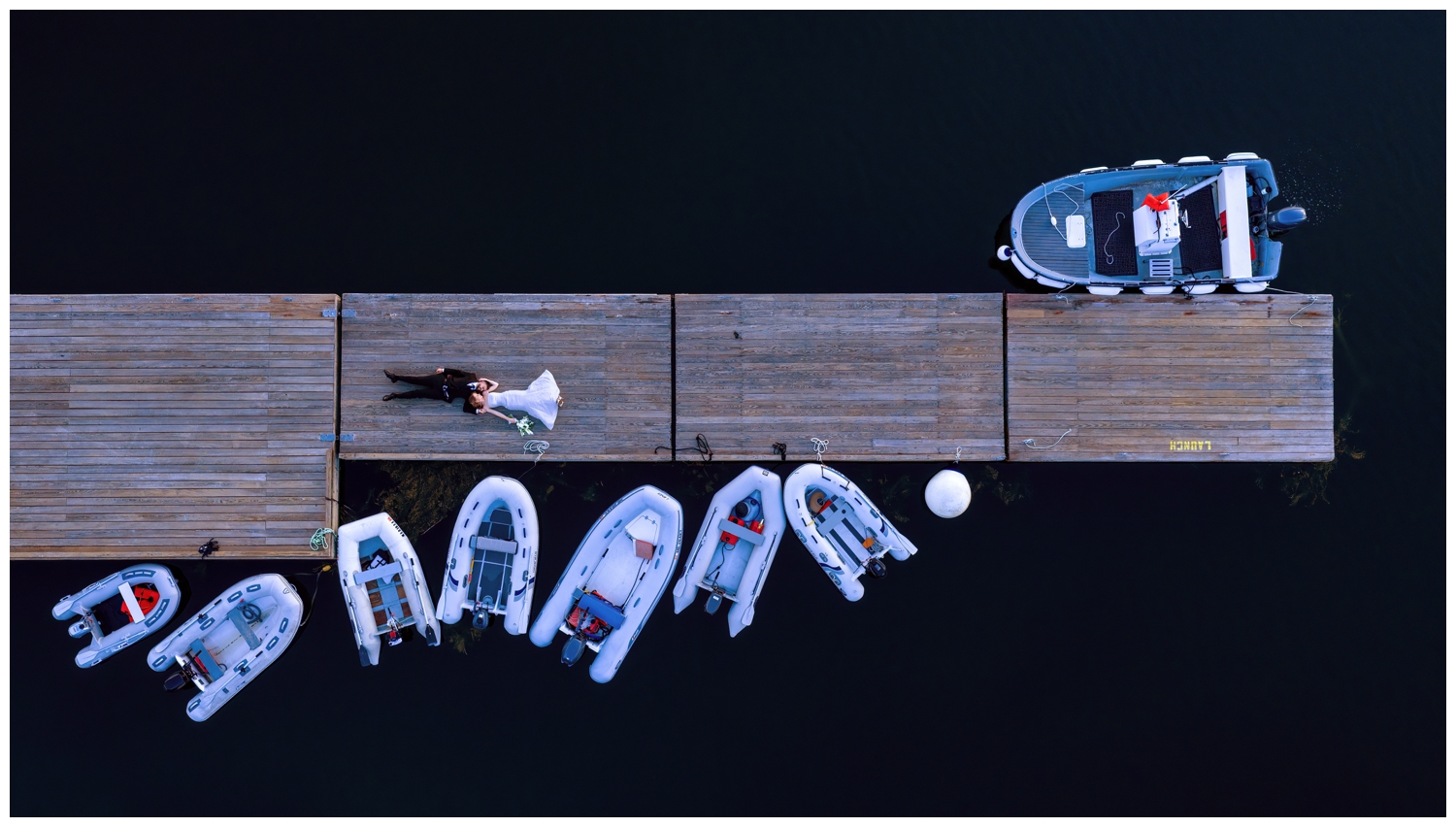 Sebasco Harbor Resort Wedding Photographers Capture a couple with a drone shot on the docks